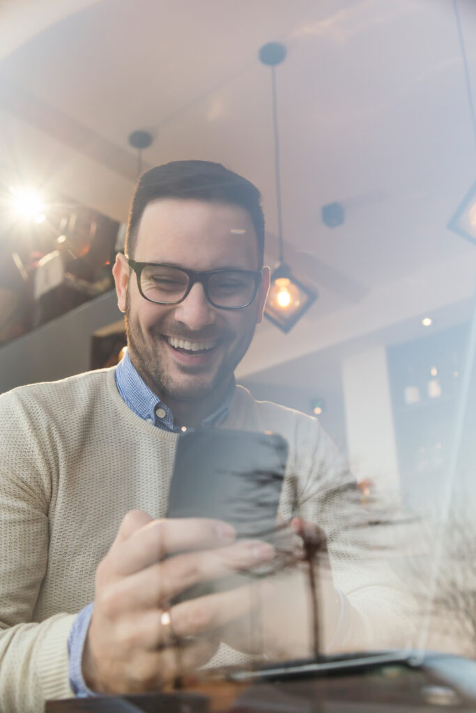Male using his phone to grow his business