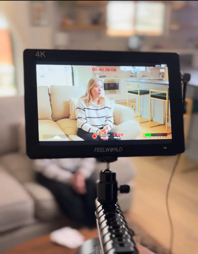 A picture of a camera screen during a video shoot of a testimony