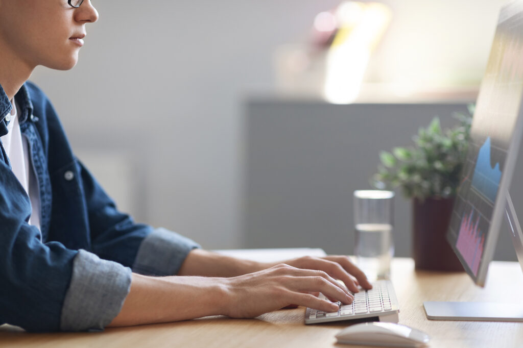 Man on his computer updating his website