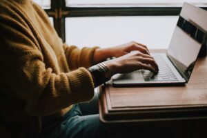 Person on computer writing ALT text on their website