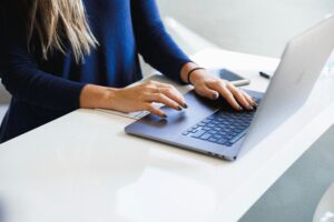 Woman on computer setting up her Google My Business profile.