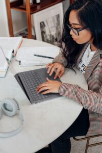 Female on her computer working on Google Ads