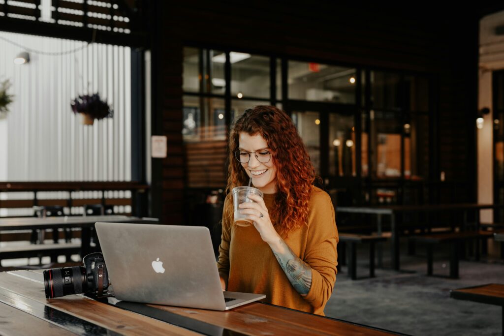 Woman on computer figuring our cost of SEO